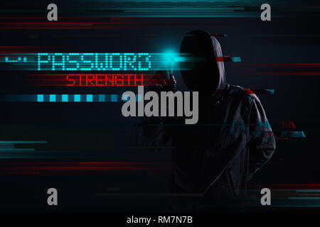 Hooded hacker in password strength concept, digitally enhanced image Stock Photo