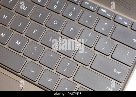 Opened laptop keyboard, touchpad and empty mirror screen of black opened laptop top view closeup Stock Photo