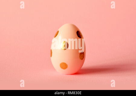 Easter egg on pastel pink background. Happy Easter concept. Minimal concept Stock Photo