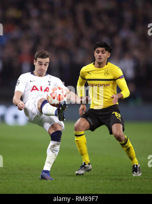 Tottenham Hotspur's Harry Winks (left) and Borussia Dortmund's Mahmoud Dahoud battle for the ball during the UEFA Champions League round of 16, first leg match at Wembley Stadium, London. Stock Photo