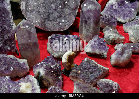 Close-up of violet amethyst crystals on a table Stock Photo