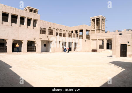 A couple of tourists at the Sheikh Saeed Al Maktoum House, a historic building and museum. It is the former residential quarters of Saeed bin Maktoum  Stock Photo