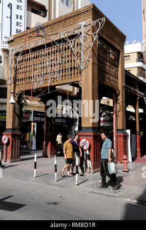 One of the main wooden structure entrances to the Dubai Gold Soukin the district of Deira in Dubai in the United Arab Emirates, (UAE).  The Gold Souk  Stock Photo