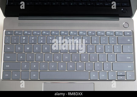 Opened modern laptop keyboard with USA alphabet on keys front top view close up Stock Photo