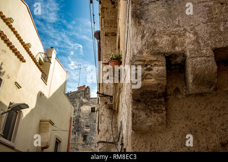 Square head architectural detail from the historic center of Altamura, Italy, Puglia region, street view, scenery summer day with puffy white clouds Stock Photo