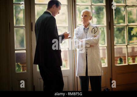 View of a doctor engrossed in a conversation. Stock Photo