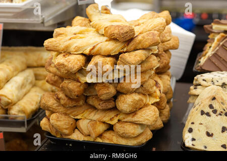 Cheese twists for sale on a market stall Stock Photo