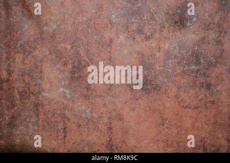 Red texture painted on canvas. Artist red primed cotton mottled grunge background. Stock Photo