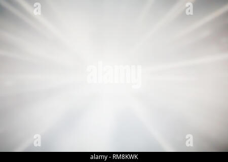 Sparkling glowing starburst background. Abstract light speed motion explosion blur texture. Stock Photo