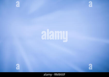 Sparkling glowing starburst background. Abstract light speed motion explosion blur texture. Stock Photo