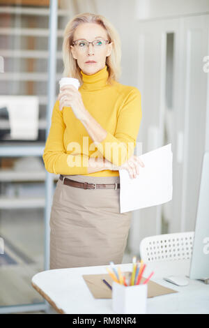 Pensive Mature Businesswoman Stock Photo