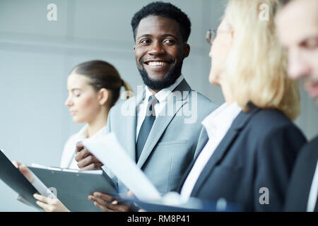 Talking while making notes Stock Photo
