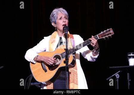 Singer, songwriter and activist Joan Baez is shown performing on stage during a 'live' concert appearance. Stock Photo