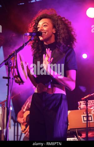 Singer Corinne Bailey Rae is shown performing on stage during a 'live' concert appearance. Stock Photo