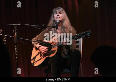 Blues guitarist and singer Rory Block is shown performing on stage during a 'live' concert appearance. Stock Photo