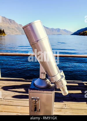 Inspection binoculars on top of a skyscraper to observe the city. Inspection binoculars on top of a skyscraper to observe the city. Stock Photo