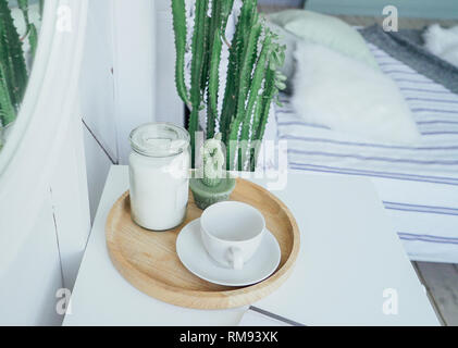Scandinavian modern interior, white table and mirror in bedroom, minimalism Stock Photo