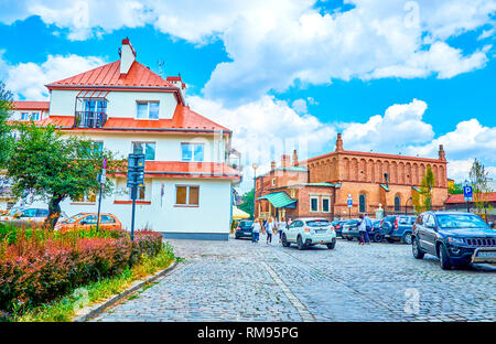 KRAKOW, POLAND - JUNE 21, 2018:  The walk along old streets of historical Jewish Kazimierz neighborhood is the best way to explore architecture of so  Stock Photo