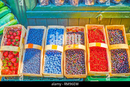 Variety of baskets with berries on vegetable market stall in Krakow, Poland Stock Photo