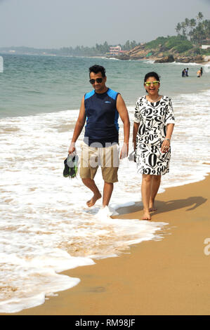 couple walking kollam beach, Trivandrum, Kerala, India, Asia, MR#801B, MR#802B Stock Photo