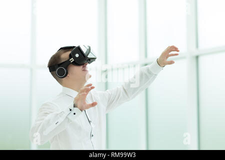 young employee is testing virtual reality glasses Stock Photo