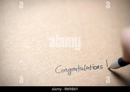 Hand writing congratulations note Stock Photo