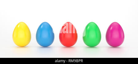 Green, cyan and pink colored Easter eggs balanced on its blunt end on white background with wide copy space Stock Photo