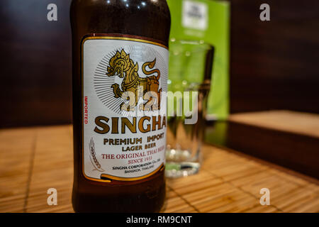 Bottle of Singha Beer on a table in a Thai restaurant in Wath, Rotherham, South Yorkshire, England Stock Photo