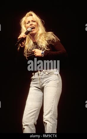 Deana Carter is shown performing on stage during a 'live' concert performance. Stock Photo