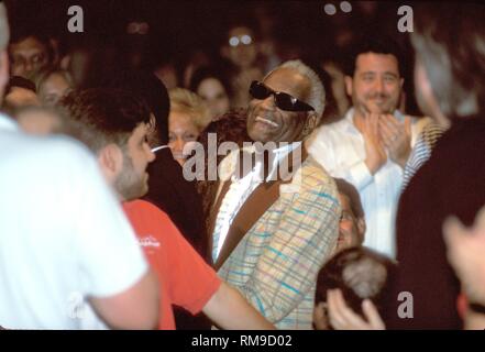Musician Ray Charles is shown being escorted to the  stage before the start of his 'live' concert performance. Stock Photo