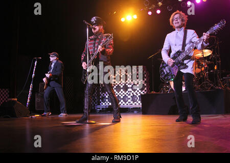 Singer Robin Zander is shown performing on stage during a 'live' concert appearance with Cheap Trick. Stock Photo