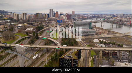 jumble of roads heads into and around Portland  the Willamette River flowing underneath Stock Photo