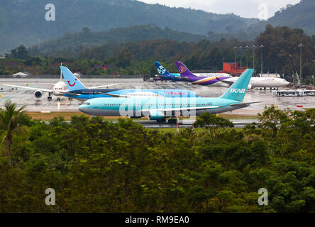 Takeoff aircraft in tropical rain Stock Photo
