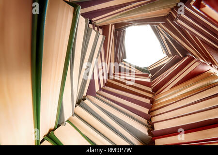 Large hardcover books pile. Wide angle view from inside Stock Photo