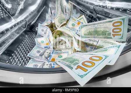 Dollars into washing machine drum. Money laundering concept Stock Photo