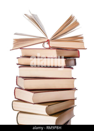 Large books pile with single open book on it isolated on white Stock Photo