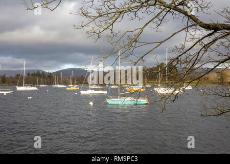 Boats on Lake Windemere on a grey sky winters day,Lake District,Cumbria,England Stock Photo