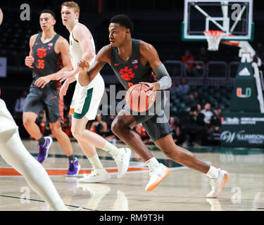 Coral Gables, Florida, USA. 13th Feb, 2019. Clemson Tigers guard Clyde Trapp (0) drives the ball against the Miami Hurricanes during the first half of an NCAA men's basketball game at the Watsco Center in Coral Gables, Florida. Mario Houben/CSM/Alamy Live News Stock Photo