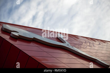 14 February 2019, Bavaria, Herzogenaurach: The logo of the sporting goods manufacturer Puma SE hangs on the outside facade of the company's headquarters. On 14 February, the sporting goods manufacturer will present its balance sheet for the year 2018. Photo: Daniel Karmann/dpa Stock Photo