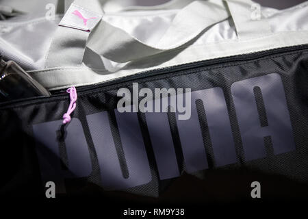 Herzogenaurach, Germany. 14th Feb, 2019. A bag with the logo of the sporting goods manufacturer Puma SE is exhibited in the company. On 14 February, the sporting goods manufacturer will present its balance sheet for the year 2018. Credit: Daniel Karmann/dpa/Alamy Live News Stock Photo