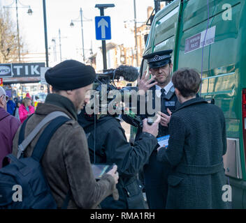 Romford London 14th February 2019. The second of the Metropolitan Police trials, outside Romford railway station, of the controversial live face recognition technology has taken place. It attracted international media interest with camera crews from Al Jazeera, Japan and France, among others, covering the trial. The facial recognition cameras scan passing pedestrians and if any of them are on a police 'watch list' they will be stopped. The last trial at Romford resulted in five arrests. Credit: Ian Davidson/Alamy Live News Stock Photo