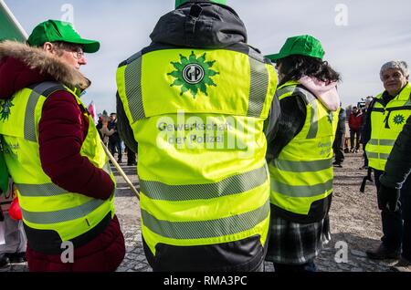 February 14, 2019 - Munich, Bavaria, Germany - To signify the failure of the second round of talks with employers, the German Verdi Ver.di labor union organized a 200+ strong flashmob action at the famed Schloss Nymphenburg in Munich to kick off a new strike wave.  The Union chose Castle Nymphenburg due to the pride and money Bavarian Ministerpresident Markus Soeder has invested into the castles of Bavaria, which in return have become major tourist attractions and income sources.  The union states that some of the money should be invested in the workers that that help keep these sites in opera Stock Photo