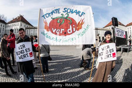 February 14, 2019 - Munich, Bavaria, Germany - To signify the failure of the second round of talks with employers, the German Verdi Ver.di labor union organized a 200+ strong flashmob action at the famed Schloss Nymphenburg in Munich to kick off a new strike wave.  The Union chose Castle Nymphenburg due to the pride and money Bavarian Ministerpresident Markus Soeder has invested into the castles of Bavaria, which in return have become major tourist attractions and income sources.  The union states that some of the money should be invested in the workers that that help keep these sites in opera Stock Photo