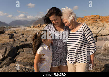 Family looking each other on beach Stock Photo