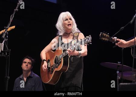 Singer, songwriter and guitarist Emmylou Harris is shown performing on stage during a 'live' concert appearance. Stock Photo