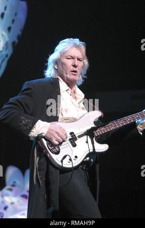 Bassist and singer Chris Squire of the progressive rock band Yes is shown performing on stage during a 'live' concert appearance. Stock Photo