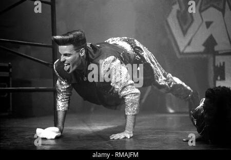 Rapper Robert Van Winkle, known professionally as Vanilla Ice is shown performing on stage during a 'live' concert appearance. Stock Photo