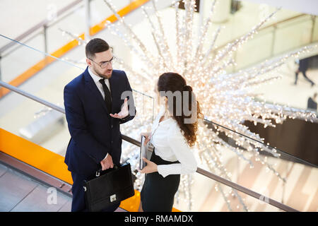 Colleagues talking in the mall Stock Photo