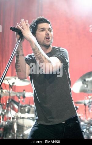 Canadian singerJason Dean Bennison of INXS, better known by his stage name J. D. Fortune, is shown performing on stage during a 'live' concert appearance. Stock Photo