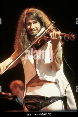 Violinist David Ragsdale of the progressive rock band Kansas is shown performing on stage during a 'live' concert appearance. Stock Photo
